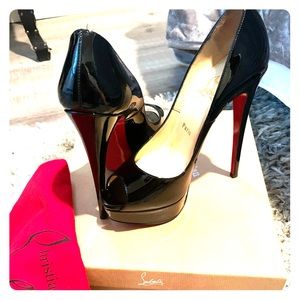 Louboutin black patent leather peep toe heels.